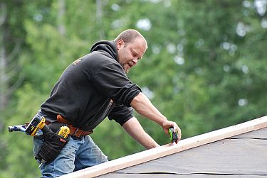 Jack, one of our Folsom roofers is taking measures on the roof top